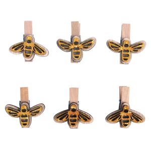 Wooden pegs with bees