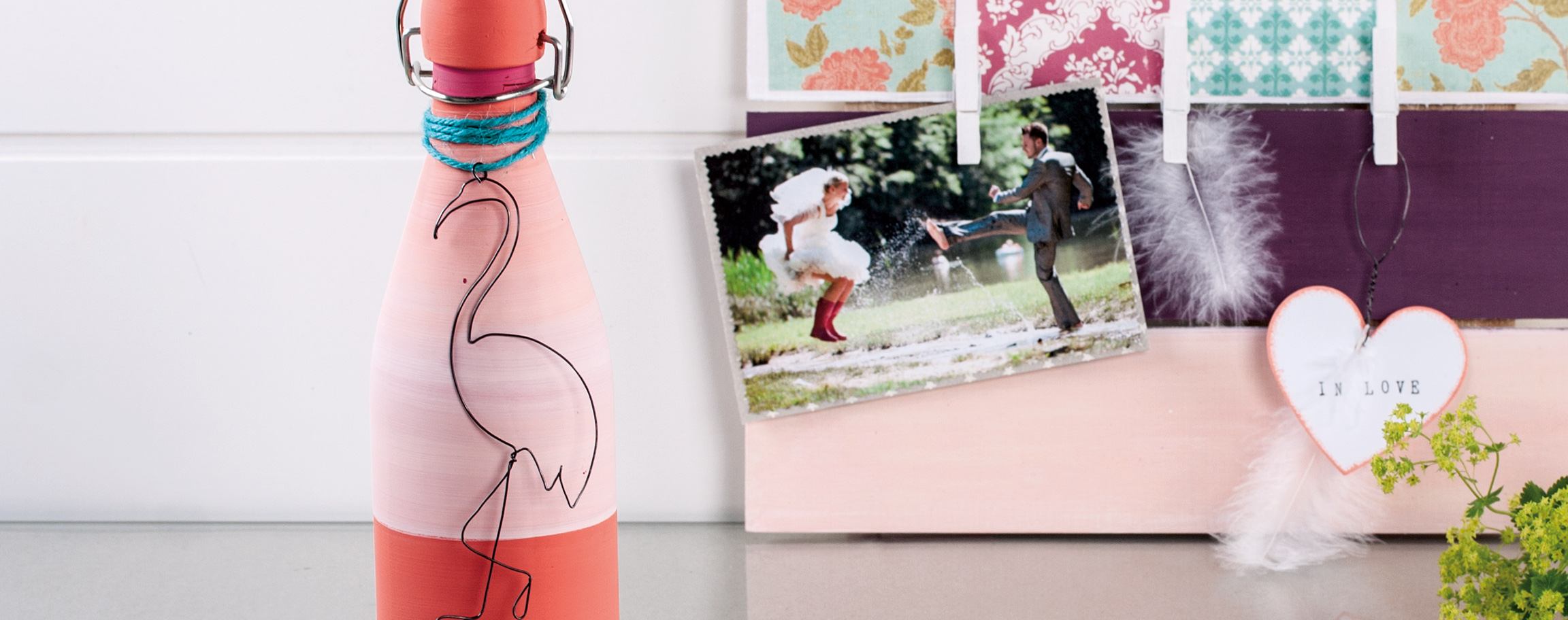 Flip-top bottle with a wire flamingo