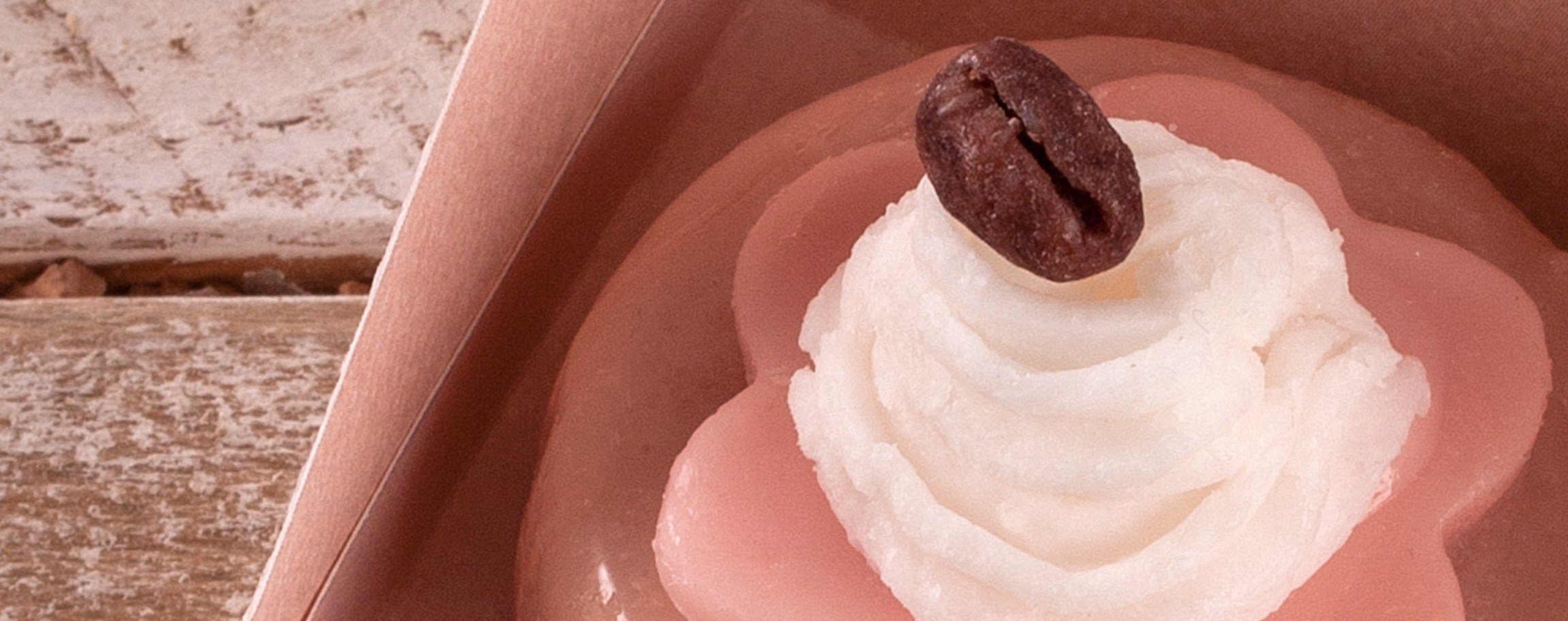 Cream-soap with chocolate glaze on the inside of a gift box