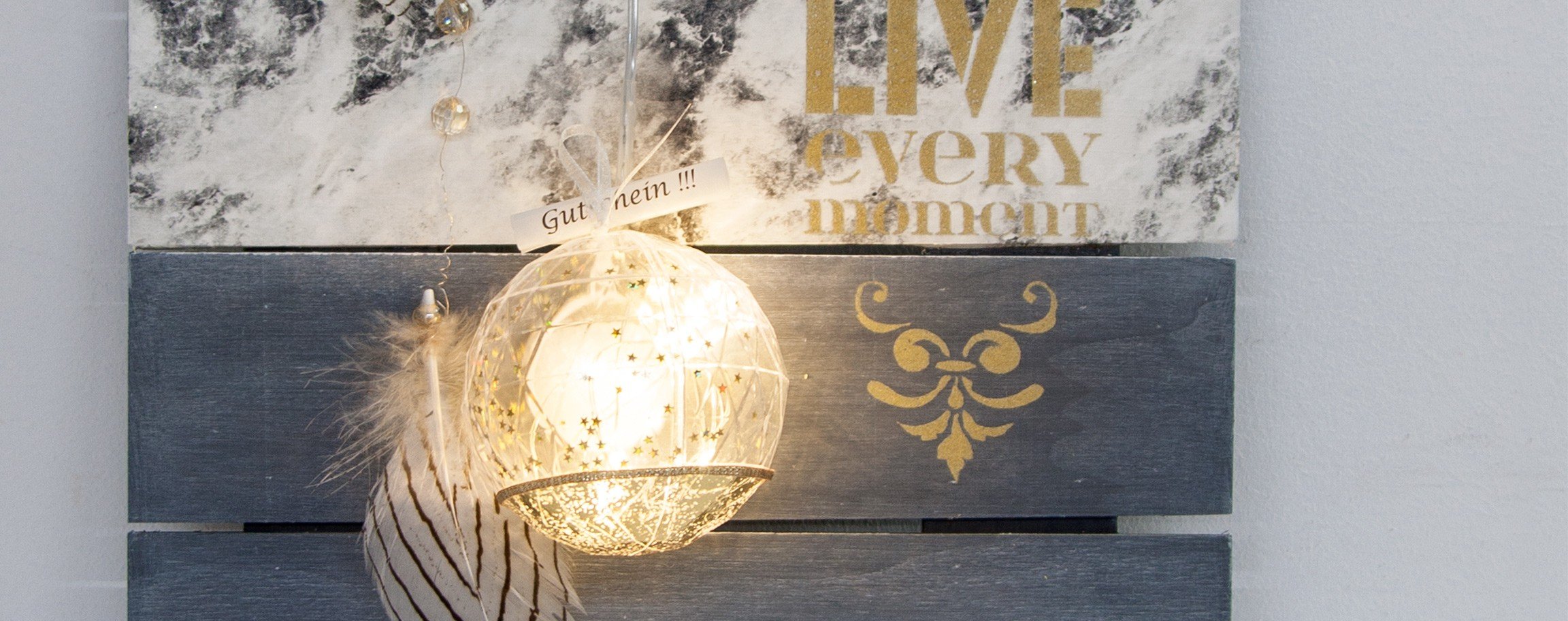 Faceted ball with bath salt on a decorative board