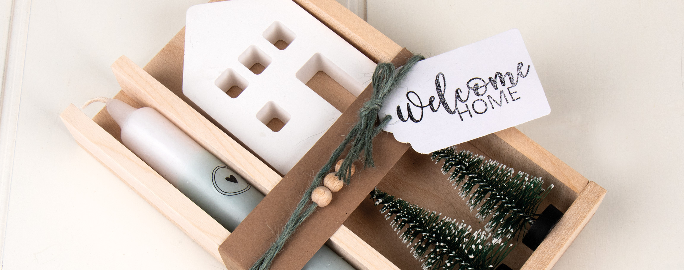 Wooden tray with house and candle