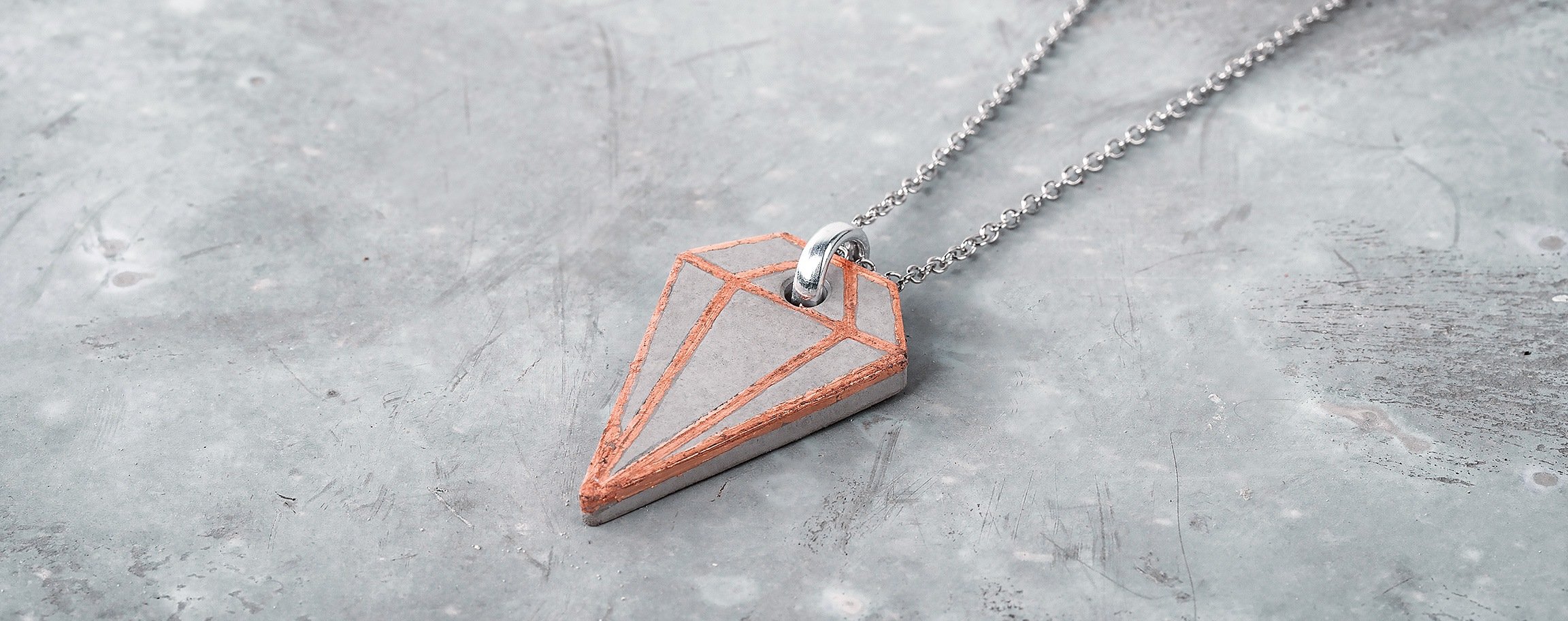 Copper-coloured diamond-shaped jewellery pendant