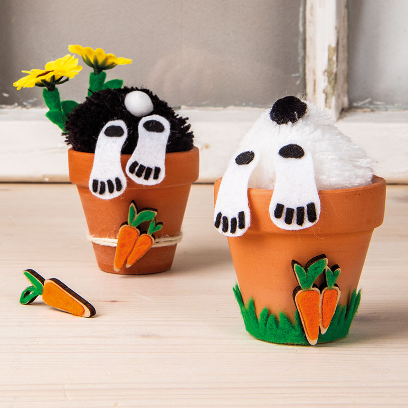 Two bunnies in a clay planter