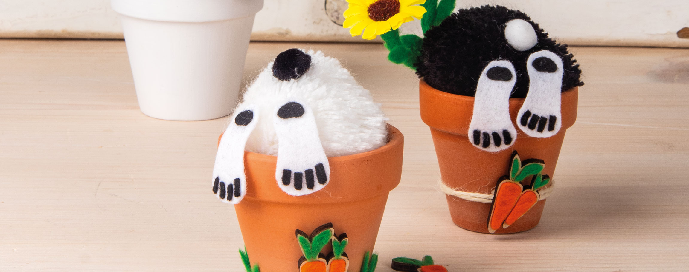 Two bunnies in a clay planter